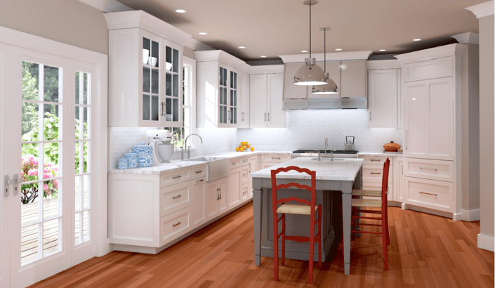 A kitchen with white cabinets and wooden floors.