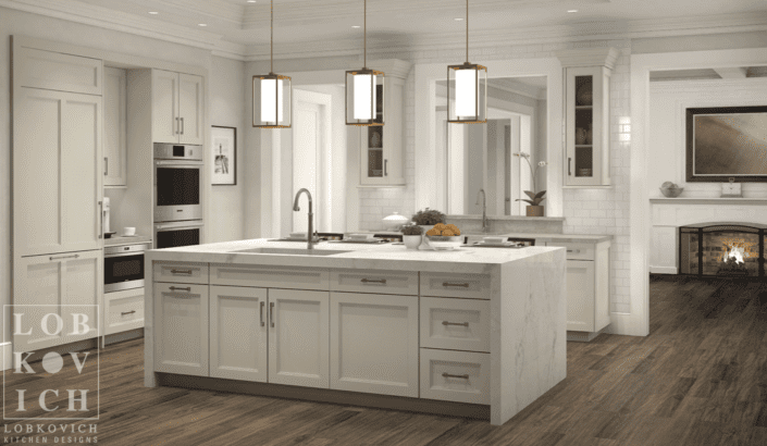 A kitchen with white cabinets and wood floors.