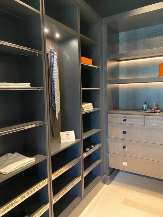 A closet with shelves and drawers in it