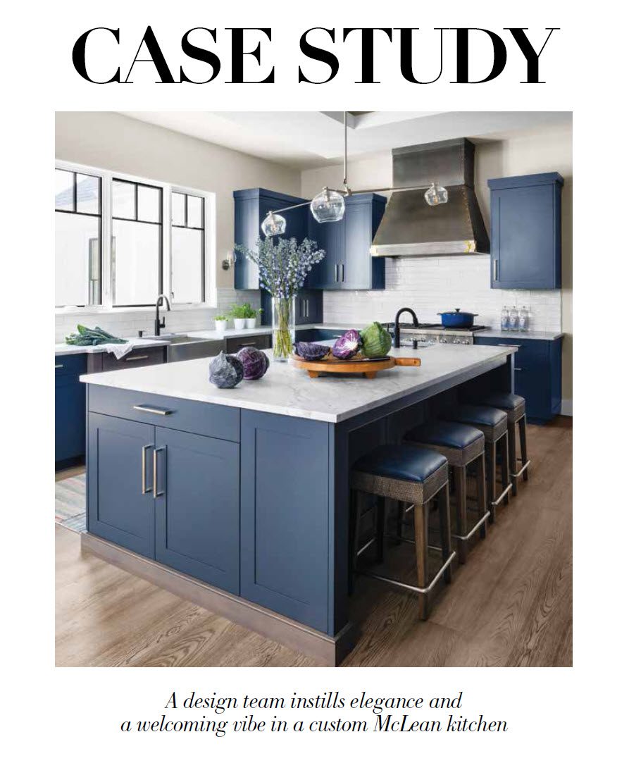 A kitchen with blue cabinets and white counter tops.