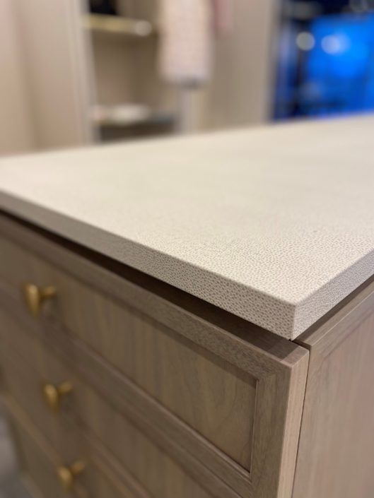 A close up of the counter top on a dresser