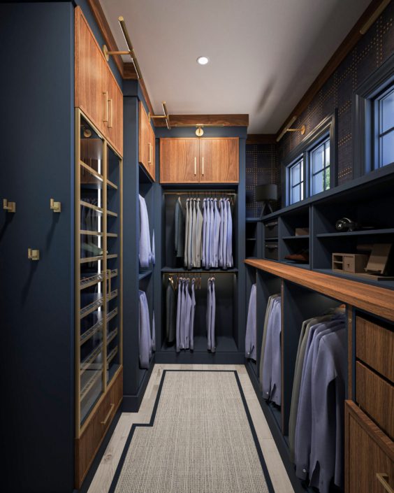 A walk in closet with many clothes hanging on the rail.